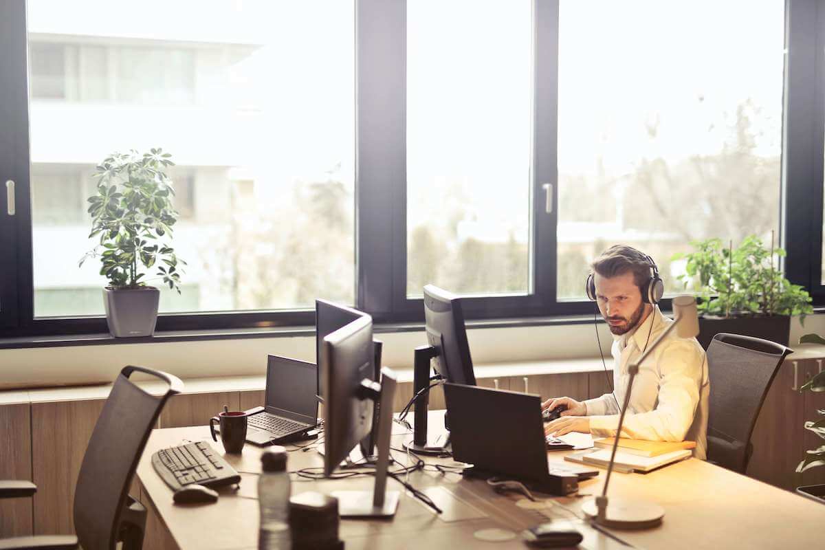 man working in office on desktop