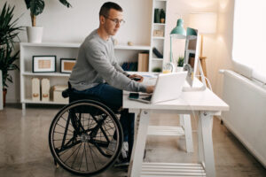 Man in a wheelchair using online banking
