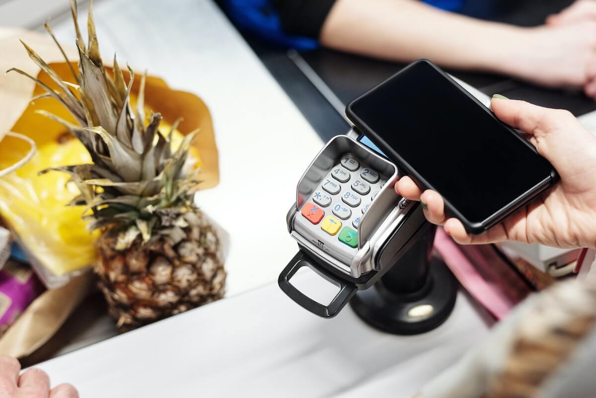 paying at register with cell phone