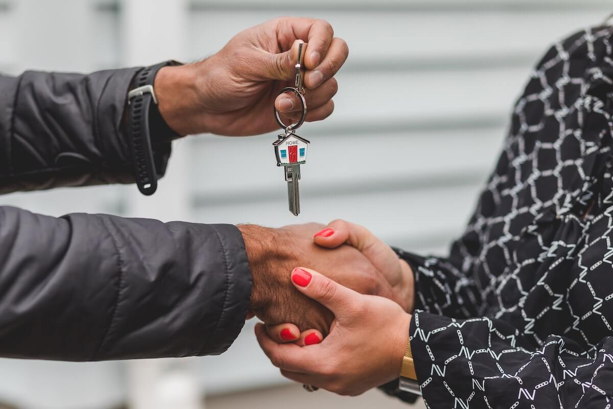 handing key to new homeowner